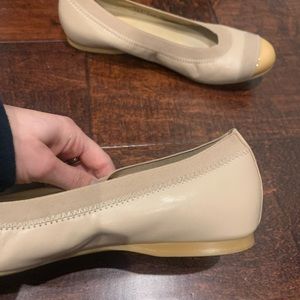 Stuart weitzman beige flats with leather toe and elastic fabric around foot